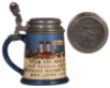 Three Mettlach steins, .5L, etched, 2002, relief pewter lid, hairline on inside at bottom; .5L, etched, 2006, old replaced pewter lid, body mint; .5L, 1655, music box base [without music box], original pewter lid, mint.&nbsp;&nbsp; - 3