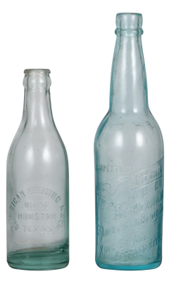 Two American Brewing Co. bottles, embossed 7.6" ht., American Brewing Ass'n uninc. Houston Texas, 9.7" ht., embossed, property of St. Louis ABC Bohemian, very good condition.