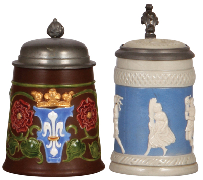 Two Mettlach steins, .3L, 2016, decorated relief, pewter lid, mint; with, .25L, 171, relief, inlaid lid, mint.