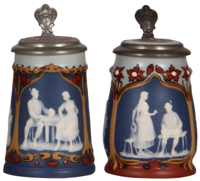 Two Mettlach steins, .3L, 2714 & .3L, 2715, cameo, by Stahl, inlaid lids, both mint.