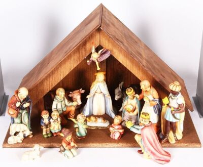 Hummel 16 Piece Nativity set with stable, 14.7" x 24.0" x 12.0" deep, wood stable, porcelain figurines, large set, number 214 A, AK, B, C, D, E, F,  G, H, J, K, L, M, N, O, 366 Angel, late 1900s, complete set, mint.