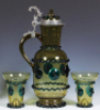 Glass pitcher, 15.2'' ht., blown, amber, green prunts & rigaree, with two beakers, 5.0'' ht., a few small flakes. - 2