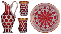 Cranberry glass pitcher set, white on ruby overlay, gilded, late 1800s, European, pitcher, 10.5'' ht., tray, 10.0'' d., two beakers, .25L, small chip on edge of tray, pitcher & beakers in excellent condition.&Ecirc; &Ecirc;