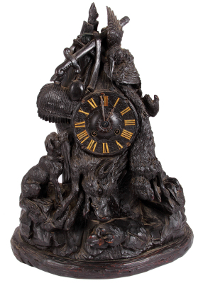 Black Forest wood hunter clock, 17.5'' ht., base 13.5'' x 6.1'', linden wood, Germany c.1900, dog, boar, rabbit, bird and hunters equipment, clock mechanism [needs adjustment] with key marked France 24352, very good condition with minor chips.