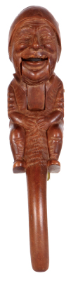 Black Forest wood carved nutcracker, 8.0'' ht., linden wood, c.1900, man with cap, glass eyes, hinged jaw to crack nuts, large full body design, wear on face, otherwise good condition.