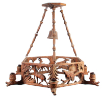 Black Forest ceiling chandelier, 34.0" diameter, 27.5" ht., linden wood, seven lamps, mid 1900s, was hanging in Hans' Bavarian Lodge Wheeling, IL,&Ecirc;color photocopy of restaurant brochure included with the lamp, good condition.