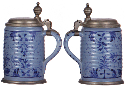 Two Faience steins, 8.2'' ht., mid 1700s, marked: K, Walzenkrug, ribbed body, pewter lid & footring, pewter strap repaired, 1'' hairline & a couple of small rim chips; with, 9.0'' ht., mid 1700s, Walzenkrug, pewter lid & footring, two 1'' hairlines, well - 2