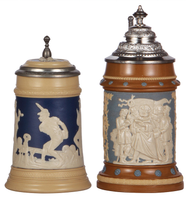 Two Mettlach steins, .5L, 2182, relief, inlaid lid, mint; with, .5L, 202, relief, original pewter lid, minor base flake, otherwise mint.