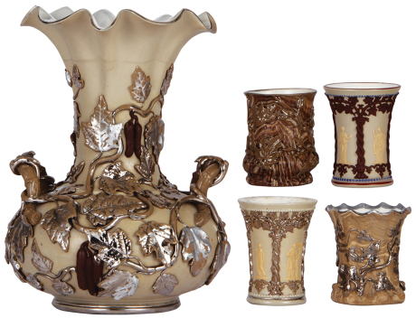 Mettlach vase & tumblers, 12.7" ht., 112, earlyware, several leaf chips repaired; with, four tumblers, 3.9" to 4.3" ht., earlyware, #10, #68, #304, #10, one has chips repaired, three in good condition.