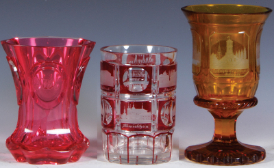 Three glass beakers, 4.4'' to 6.0'' ht., blown, clear, pink cased, wheel-cut & engraved, mint; with, yellow stained, wheel-cut & engraved, Andenken von Swinemünde, light scratches; with, red stained, wheel-cut & engraved, mint.