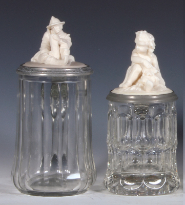 Two glass steins, .5L, blown, clear, faceted, figural parian inlaid lid, mint; with, .3L, mold blown, clear, figural parian inlaid lid, mint.