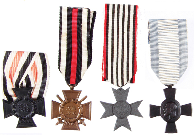 Four German medals, 1.5” x 1.5”, Honor Cross of World War I with swords; Honor Cross of World War I for non-combatants, without swords; Merit Cross for War Aid [Verdienstkreuz für Kriegshilfe]; bronze medal 7.1.1916, all good condition. 