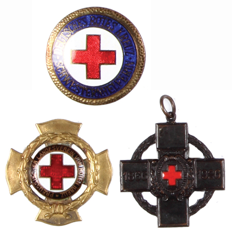 Three Rotes Kreuz Medals, 1.4” d., The Cross of the Fatherland, 1886 – 1926; Deutsches Rotes Kreuz Schwesternhelferin, Nursing Assistant badge, marked ST. & L.; Prussian Red Cross, 10 year service badge by Godet, Berlin, all very good condition.